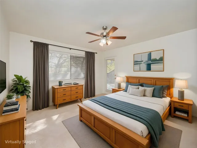a view of an empty room with a fan