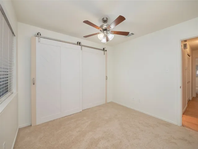 a bathroom with a sink a toilet and shower curtain