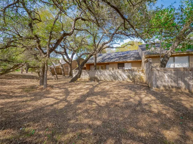a view of a yard with trees