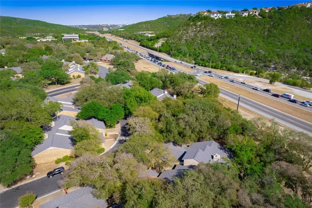 an aerial view of a house with a garden