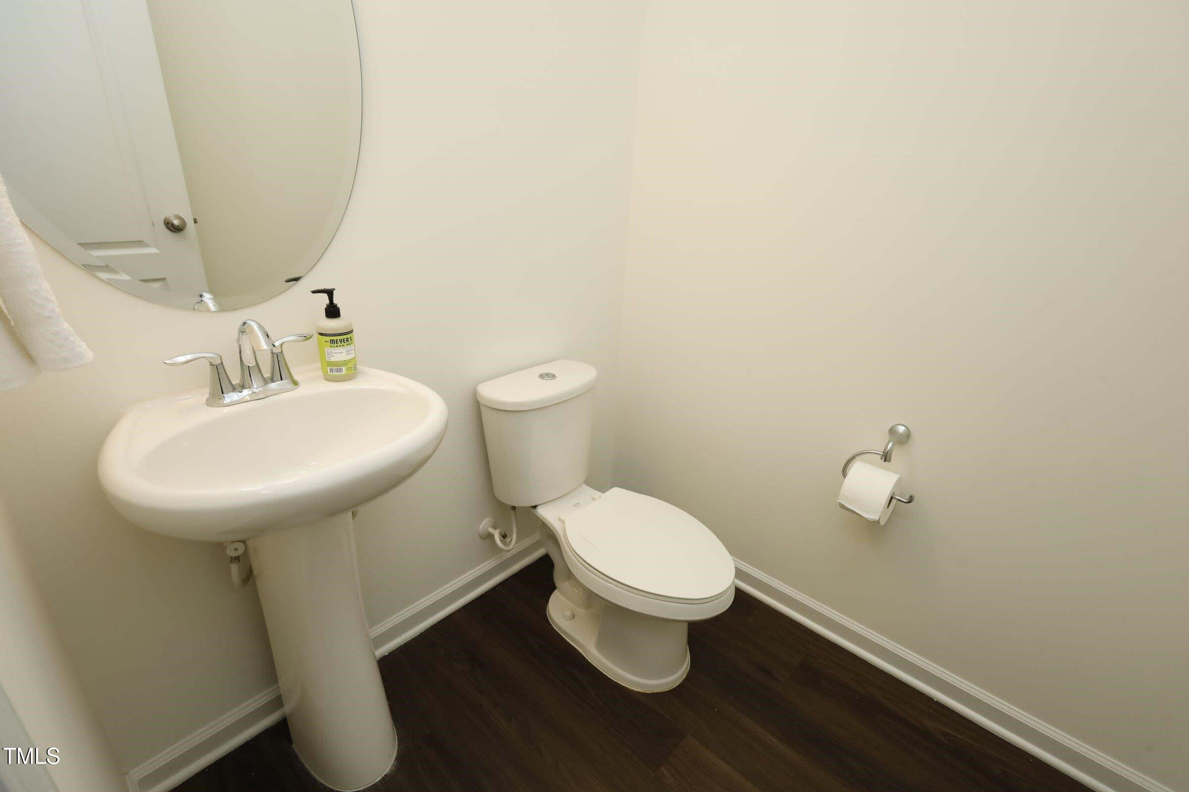 4121 Mahal Avenue Cary, NC 27519 - Photo 15 of 33 a bathroom with a sink toilet and a mirror