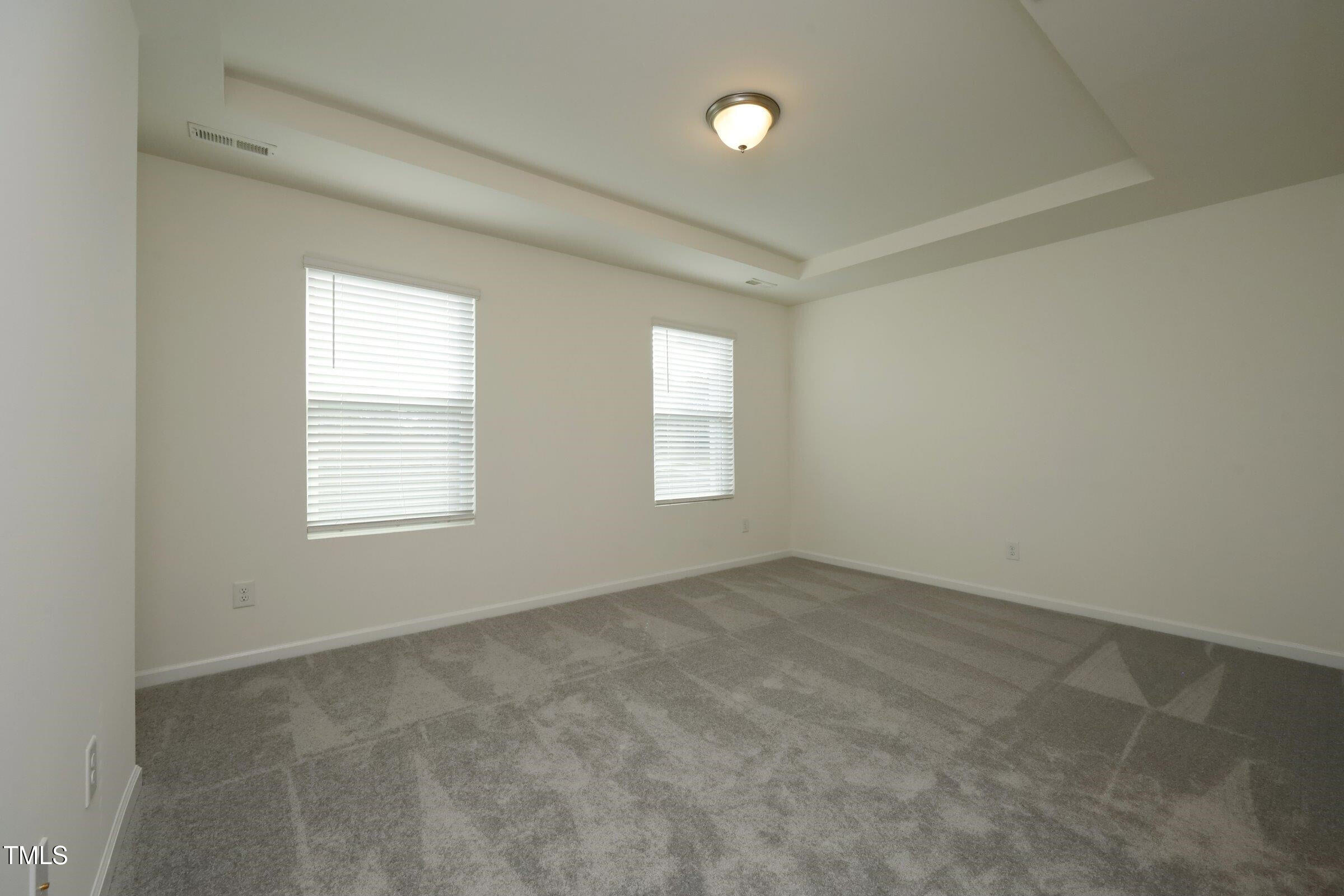 4121 Mahal Avenue Cary, NC 27519 - Photo 24 of 33 an empty room with windows