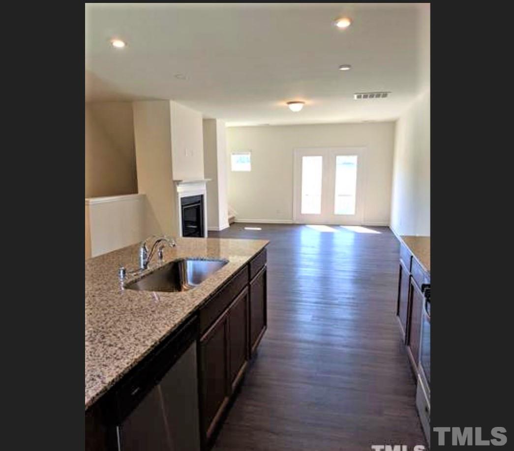 4121 Mahal Avenue Cary, NC 27519 - Photo 4 of 33 a kitchen with counter top space and a sink