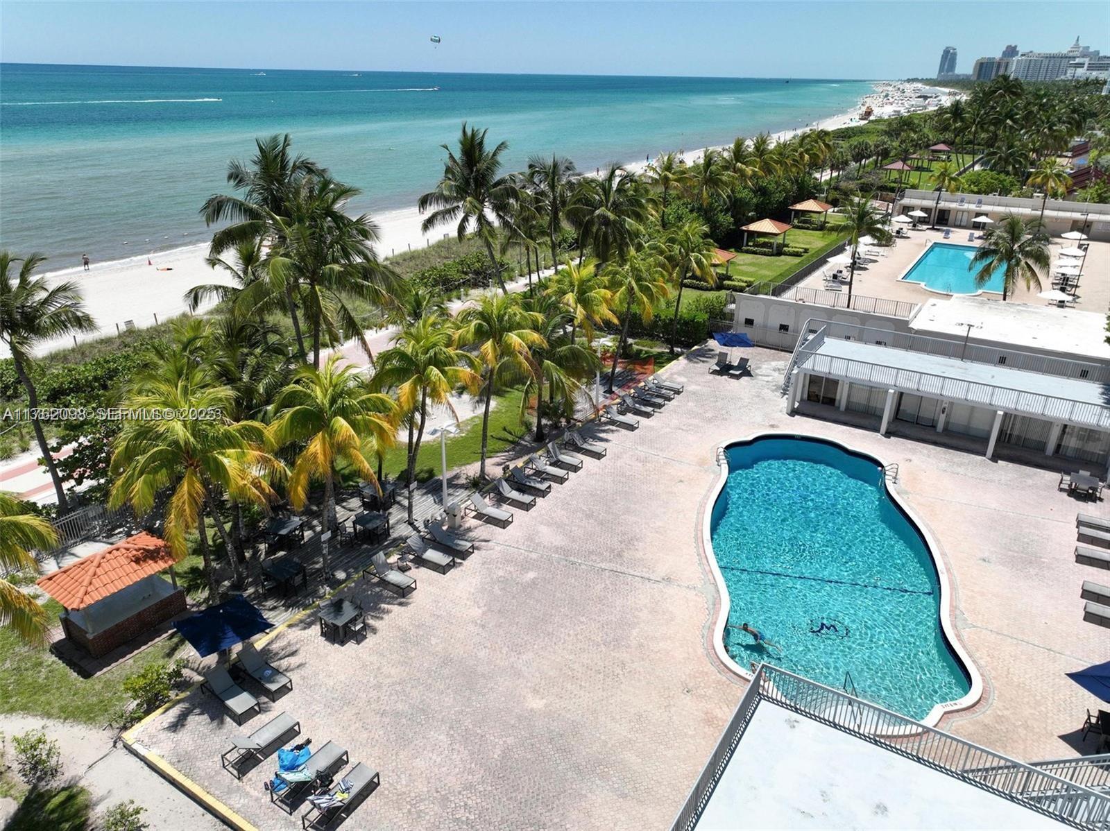 2655 Collins Avenue, Unit 1906 Miami Beach, FL 33140 - Photo 19 of 35 Pool with area for family and friends gathering/ Cabanas are owned by owners only. Showers and Bathrooms available. Plus a gate leading to the beach.
