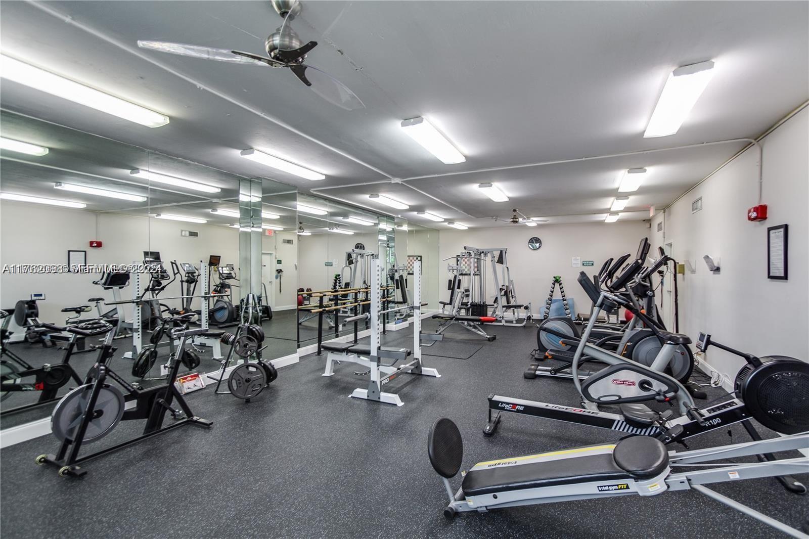 2655 Collins Avenue, Unit 1906 Miami Beach, FL 33140 - Photo 28 of 35 a view of a room with gym equipment