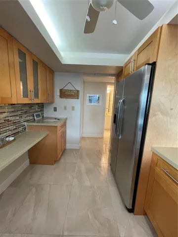 a kitchen with a refrigerator and a microwave