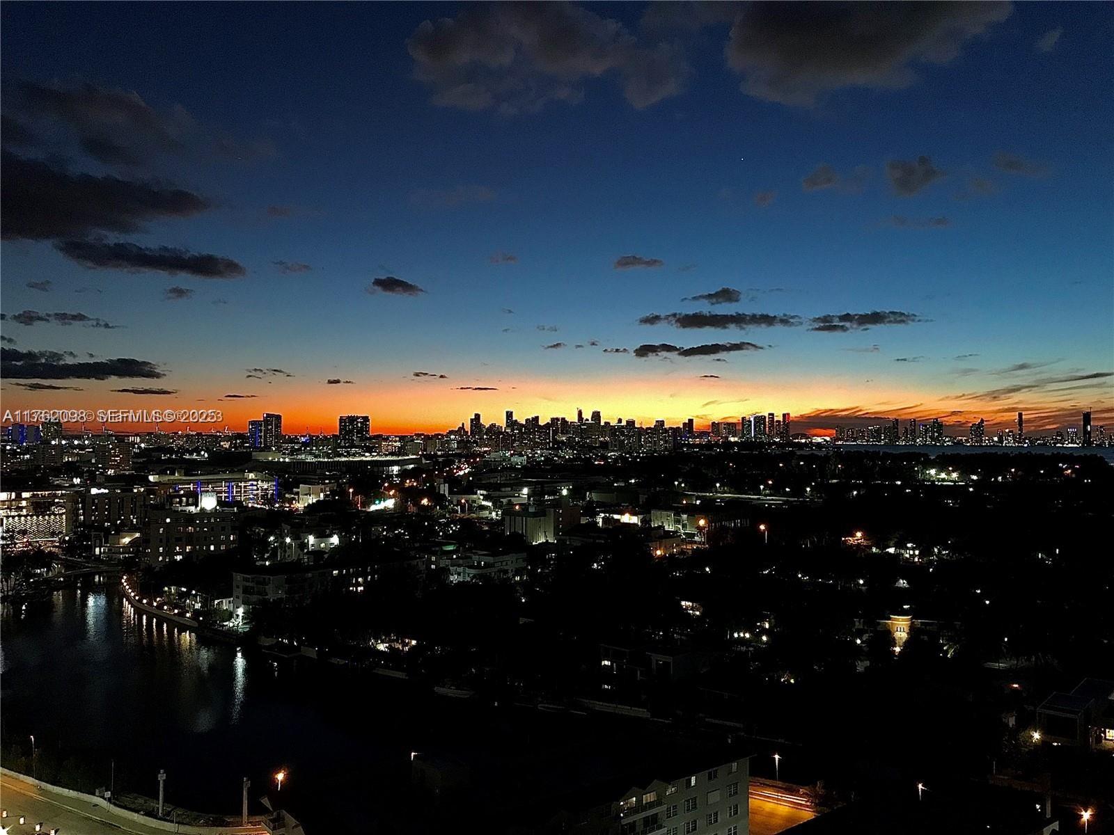 2655 Collins Avenue, Unit 1906 Miami Beach, FL 33140 - Photo 32 of 35 Night View from the Balcony toward the Bay/Miami Downtown/ It is very Beautiful and Pleasant to enjoy.
