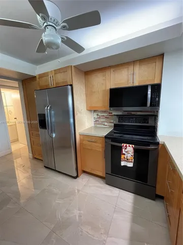 a kitchen with a refrigerator