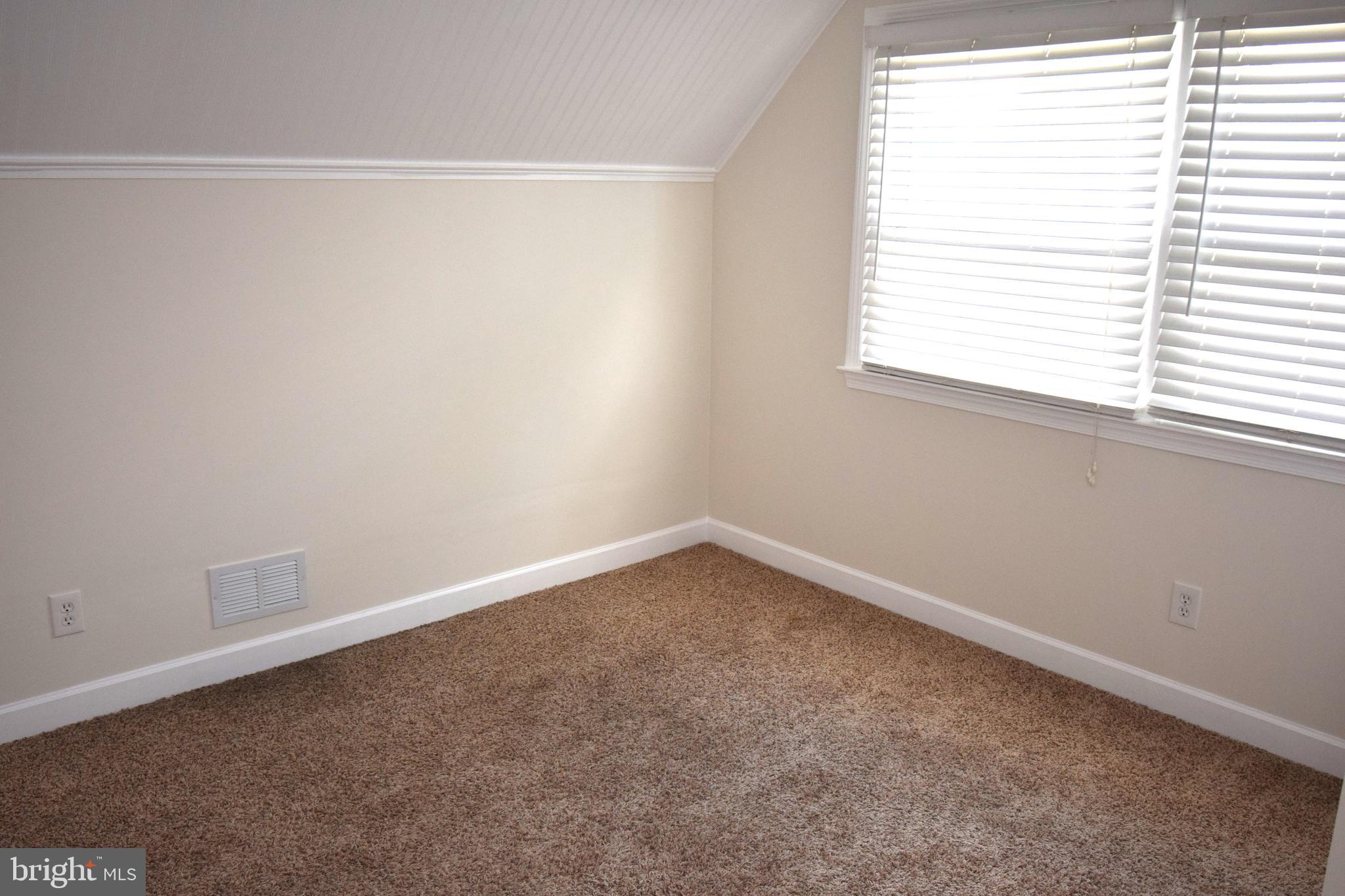 1354 Sudvale Road Pikesville, MD 21208 - Photo 12 of 17 an empty room with a window