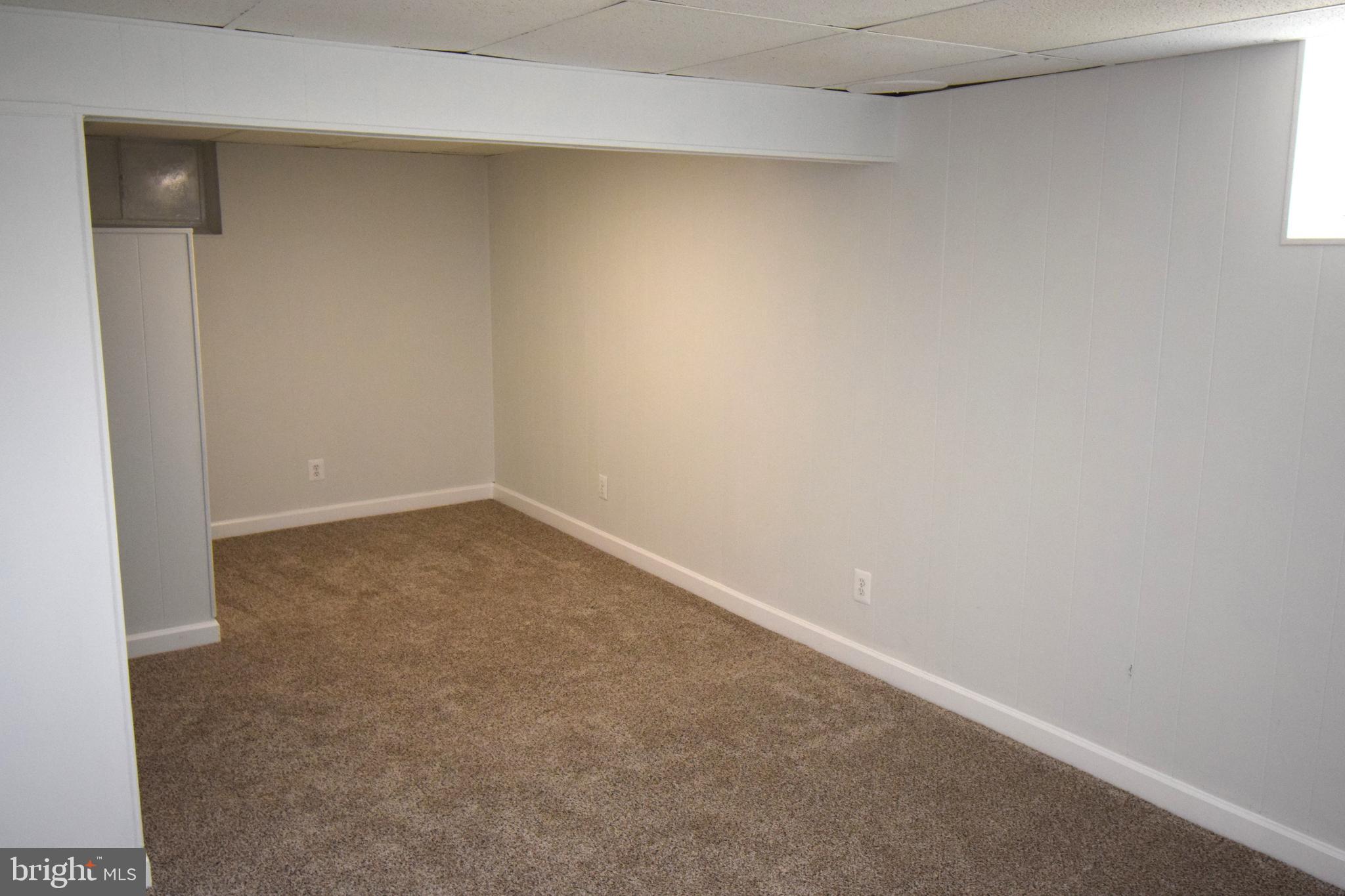 1354 Sudvale Road Pikesville, MD 21208 - Photo 14 of 17 an empty room and window