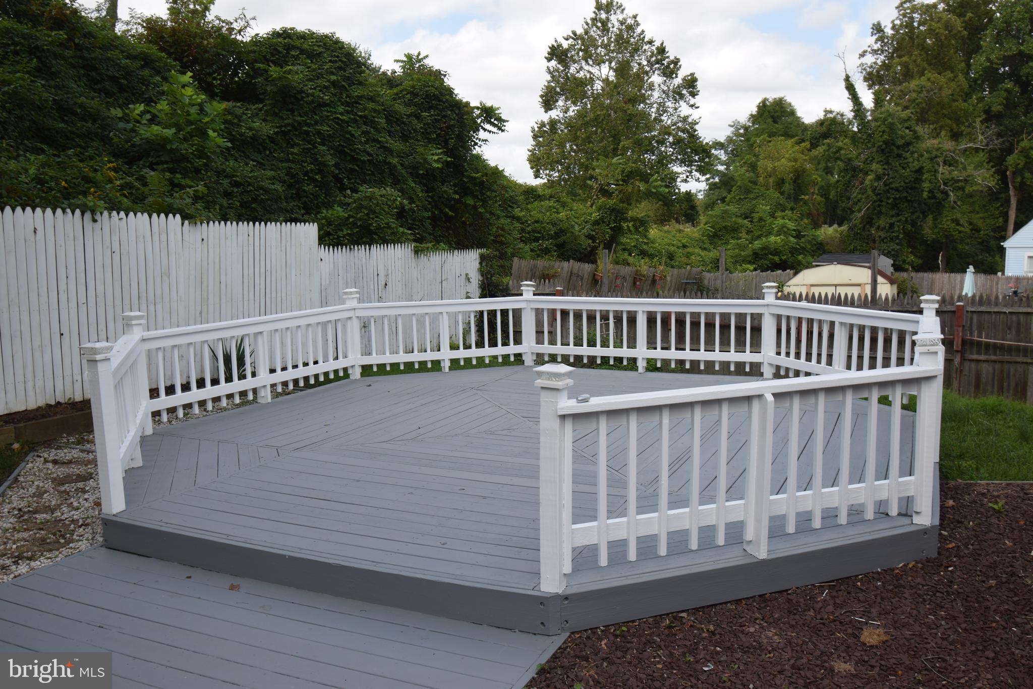 1354 Sudvale Road Pikesville, MD 21208 - Photo 2 of 17 a view of deck with a chair and wooden floor