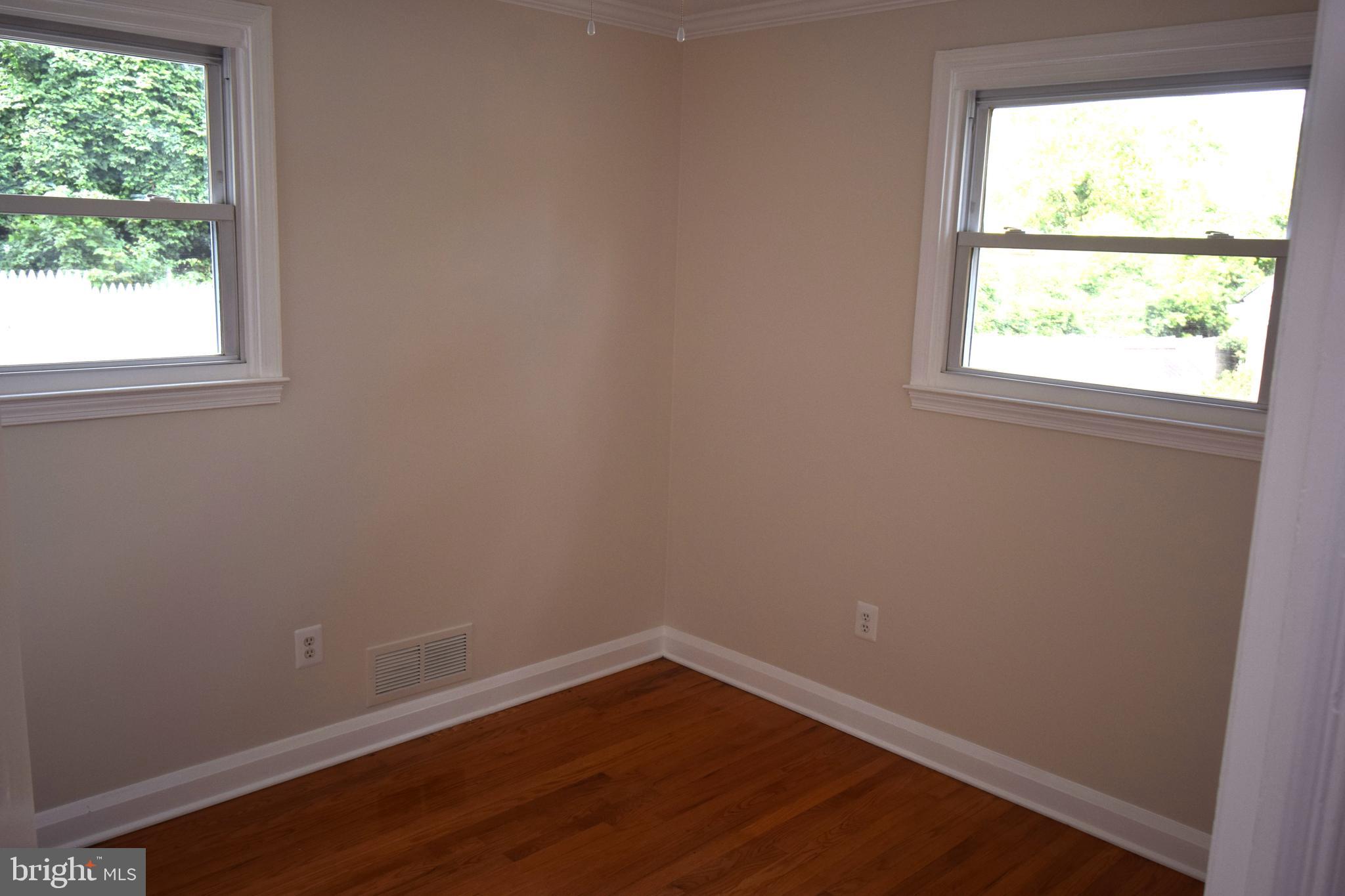 1354 Sudvale Road Pikesville, MD 21208 - Photo 8 of 17 an empty room with a window