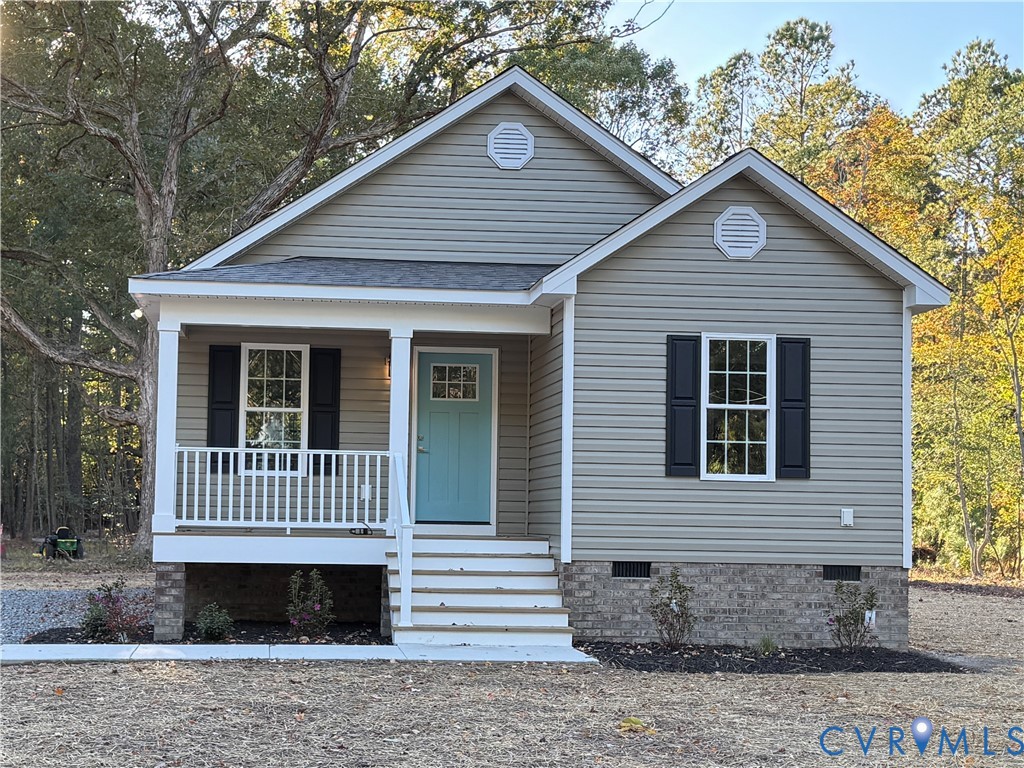 26 Tupelo Street Deltaville, VA 23043 - Photo 1 of 38 a view of a house with a yard
