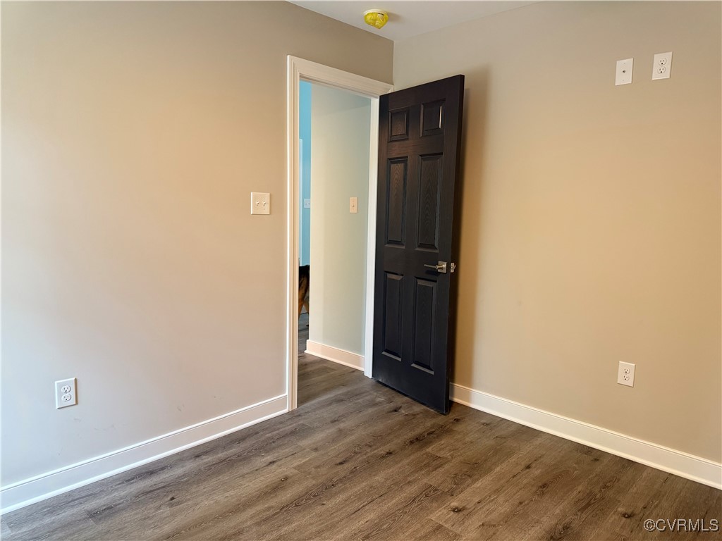 26 Tupelo Street Deltaville, VA 23043 - Photo 19 of 38 a view of an empty room with wooden floor and closet