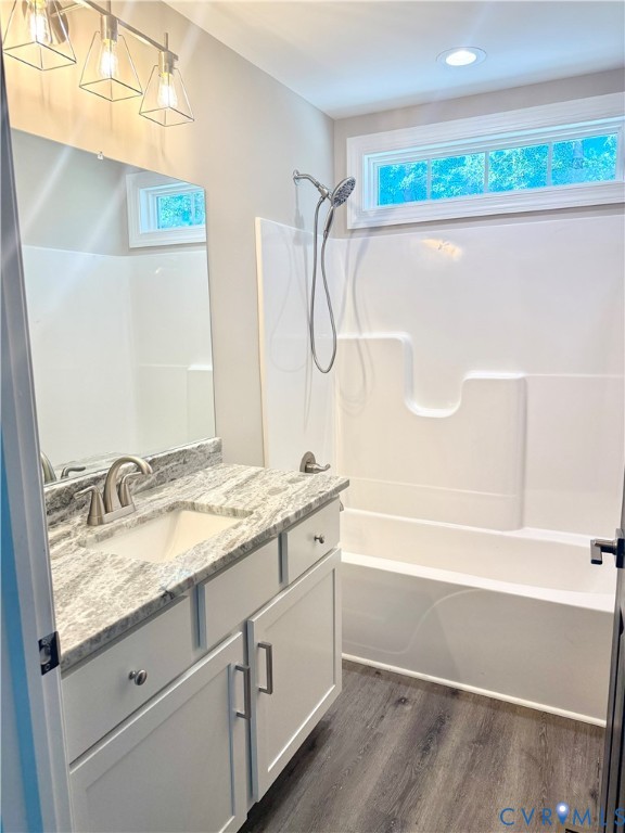 26 Tupelo Street Deltaville, VA 23043 - Photo 20 of 38 a bathroom with a granite countertop sink and a mirror