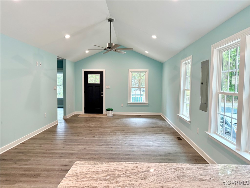26 Tupelo Street Deltaville, VA 23043 - Photo 6 of 38 a view of an empty room with wooden floor and a window