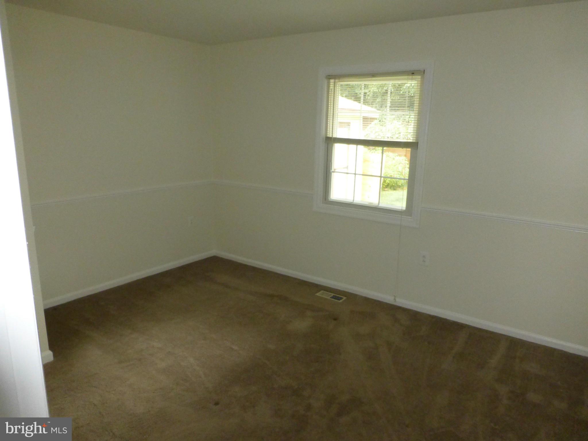 9317 Perglen Road Baltimore, MD 21236 - Photo 11 of 23 an empty room with a window