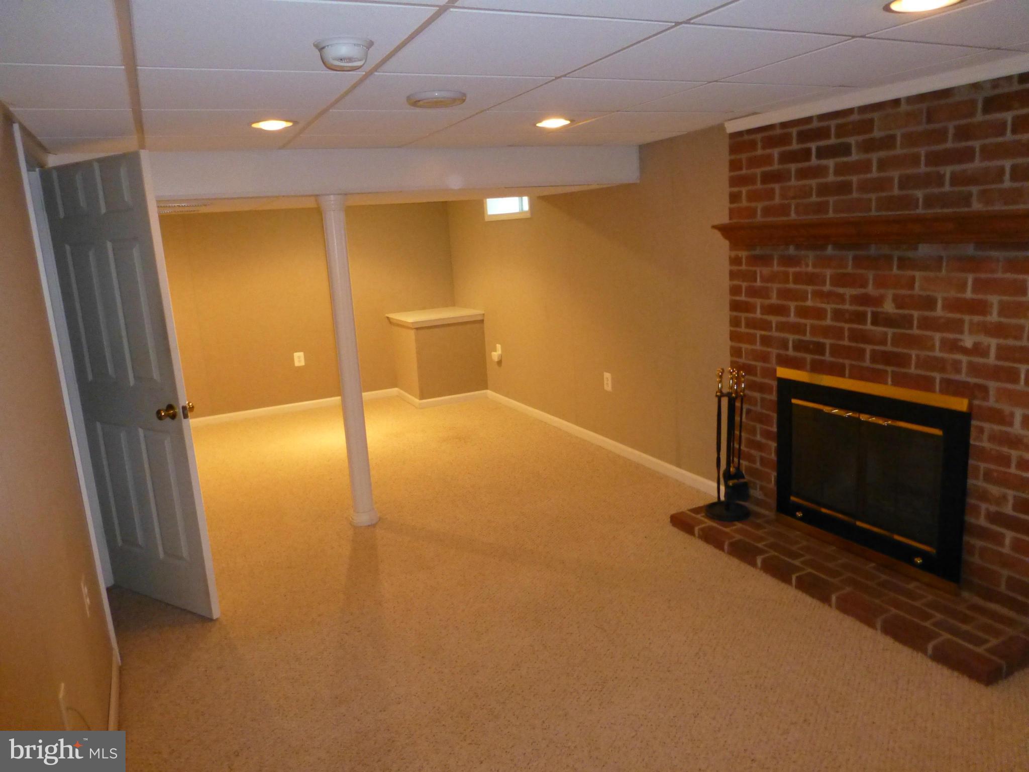 9317 Perglen Road Baltimore, MD 21236 - Photo 14 of 23 a view of an empty room and a fireplace
