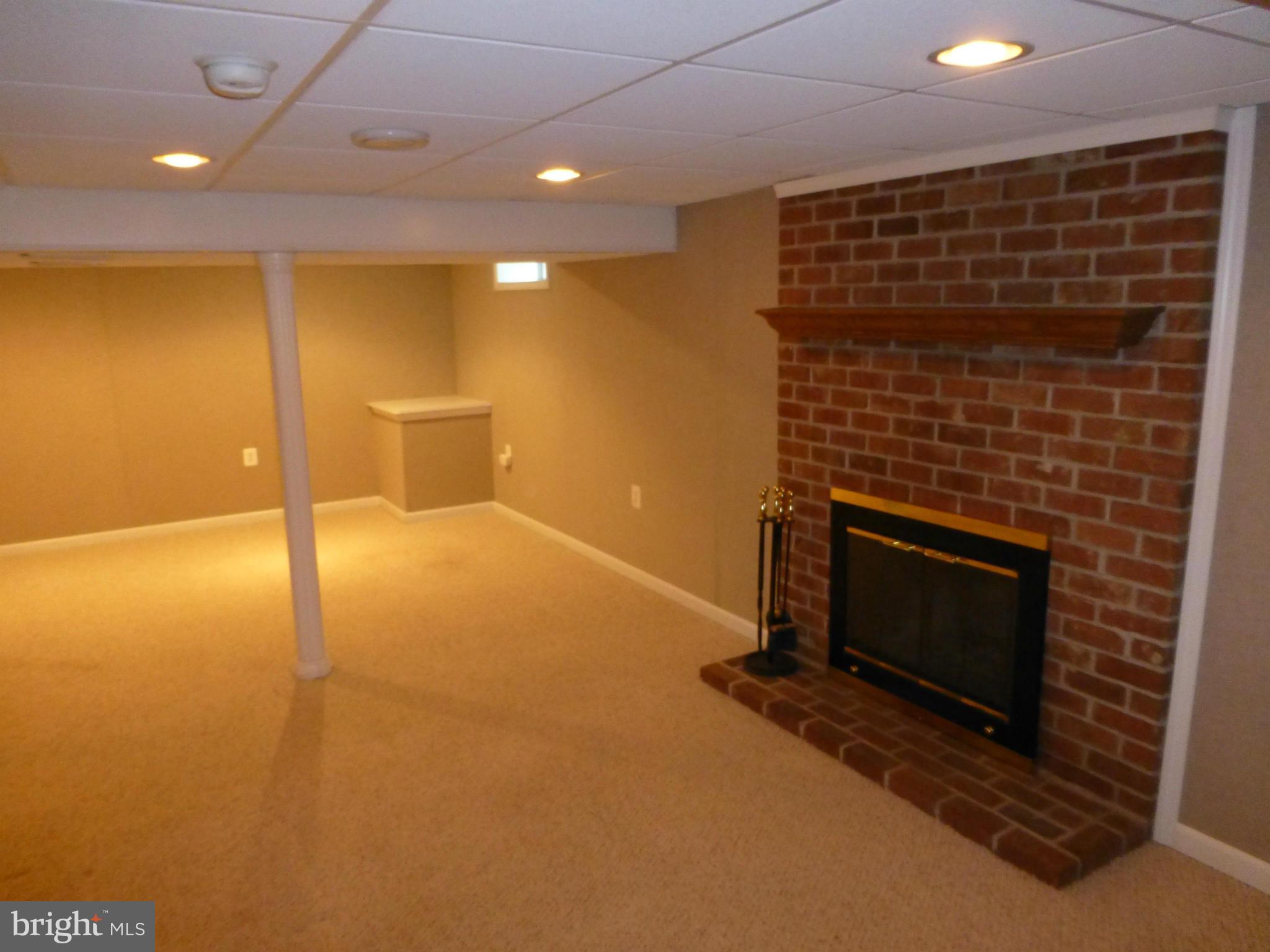 9317 Perglen Road Baltimore, MD 21236 - Photo 15 of 23 a view of an empty room with a fireplace