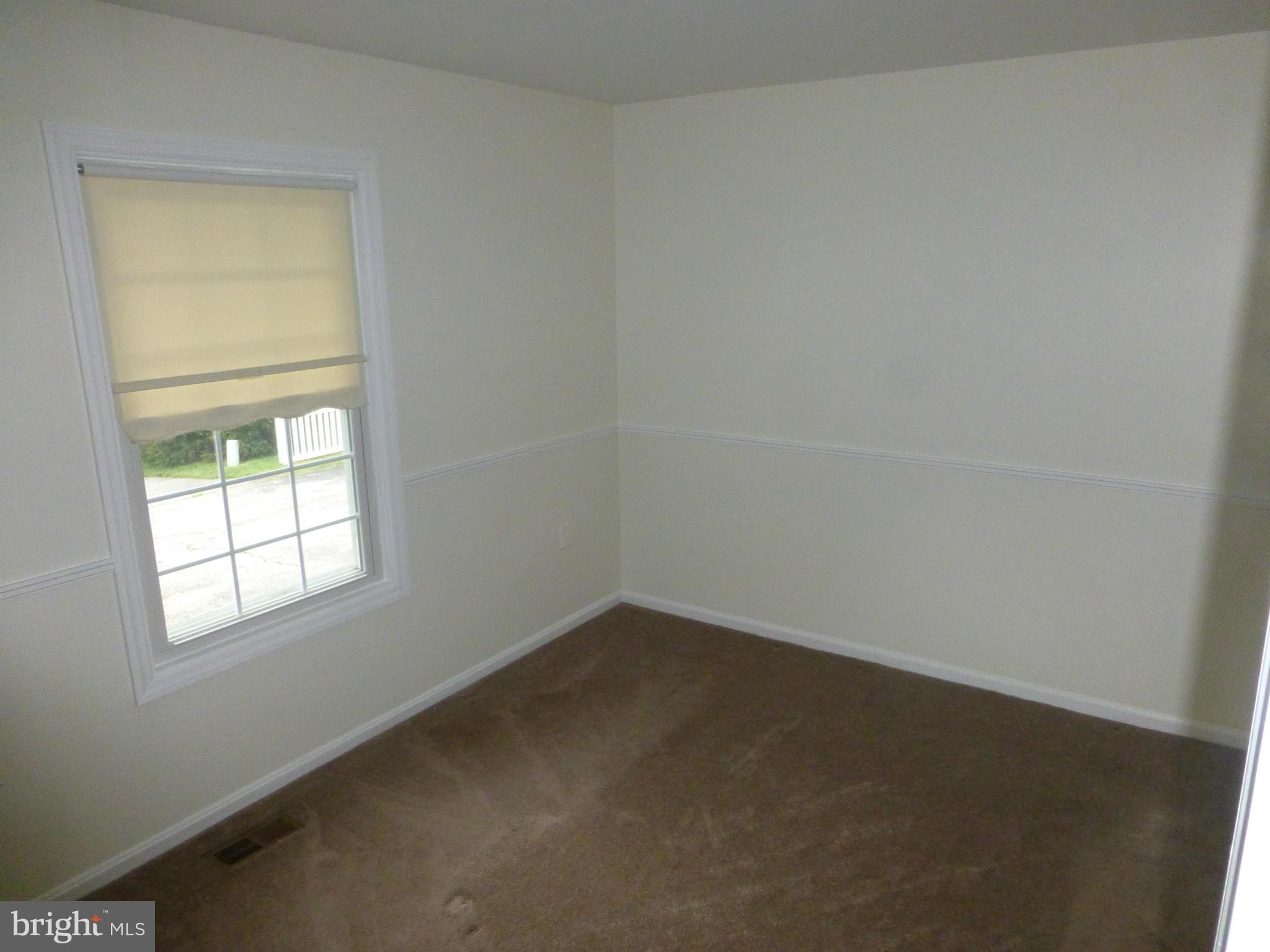 9317 Perglen Road Baltimore, MD 21236 - Photo 10 of 23 an empty room with a window