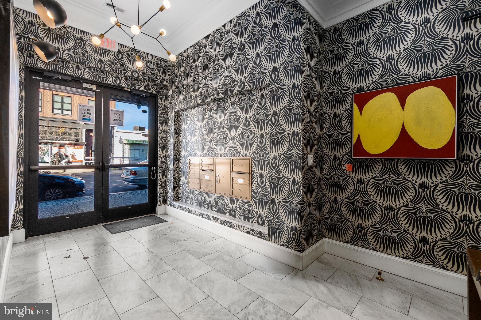 a view of entryway with a big yard and potted plants