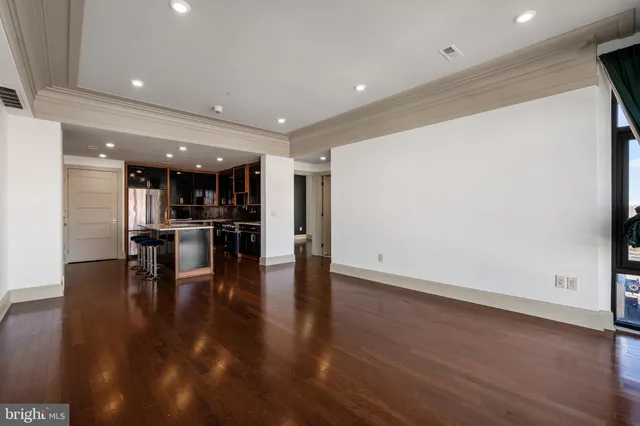a view of kitchen with furniture and wooden floor