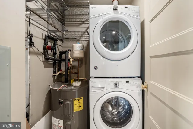 a view of a storage & utility room with washer and dryer