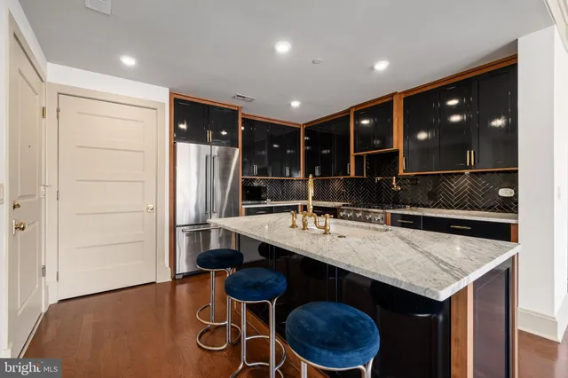 a kitchen with sink cabinets and wooden floor