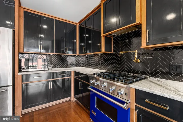 a kitchen with a stove and a refrigerator