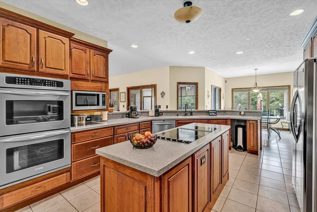 a kitchen with a stove a sink and a refrigerator