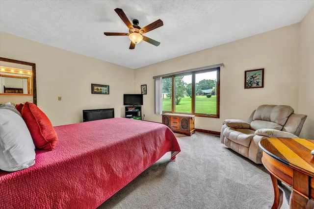 a bed room with a bed and a couch