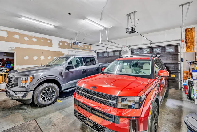 a front view of a house with a garden and yard