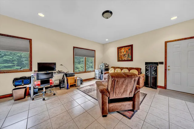 a bed room with furniture and a window