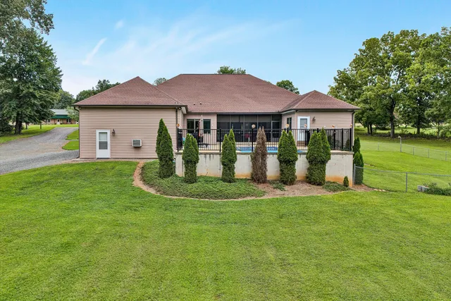 a view of a big yard with a tree