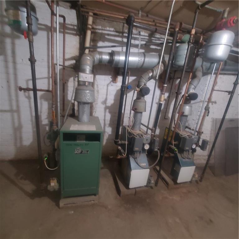 533 Sutter Avenue Brooklyn, NY 11207 - Photo 11 of 18 a view of a room with gym equipment