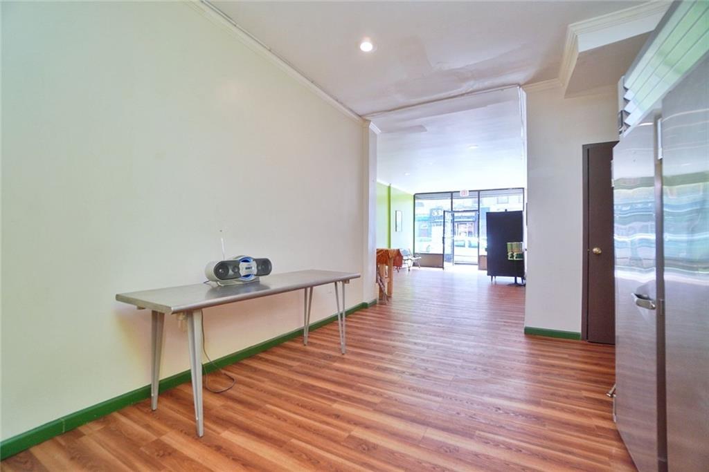 533 Sutter Avenue Brooklyn, NY 11207 - Photo 5 of 18 a view of a room with wooden floor