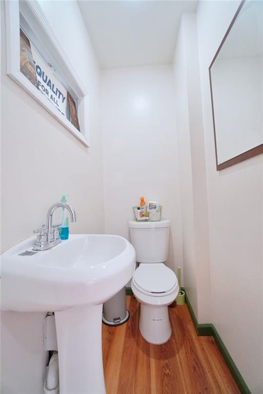 533 Sutter Avenue Brooklyn, NY 11207 - Photo 8 of 18 a bathroom with a sink and a toilet