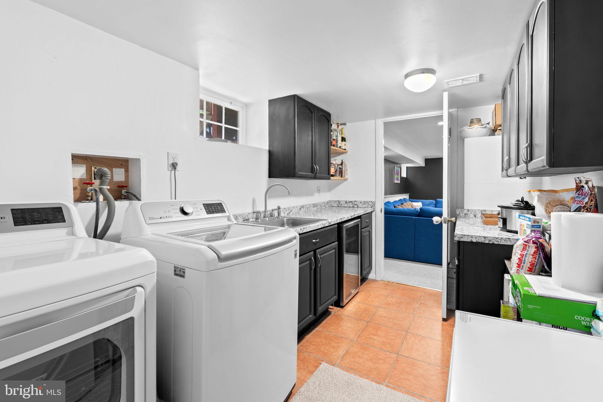 10310 Brunswick Avenue Silver Spring, MD 20902 - Photo 35 of 43 Bright and functional laundry space.