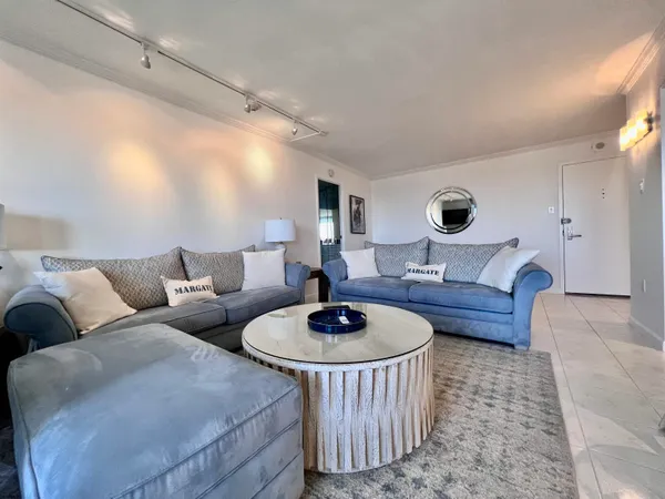 a living room with furniture and a table