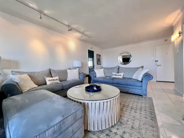 a living room with furniture and a table