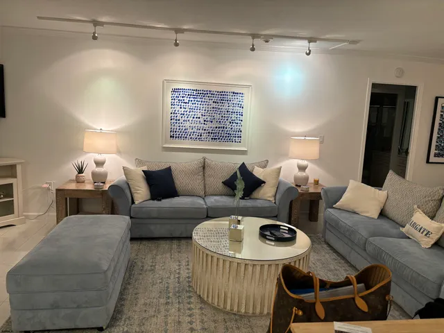 a living room with furniture and a table