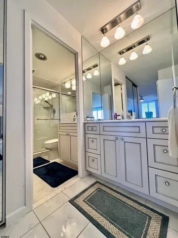 a bathroom with a sink a vanity and a mirror