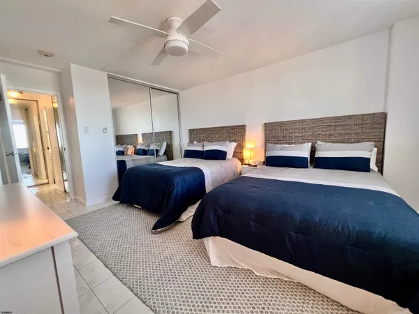 a bedroom with furniture and a fireplace