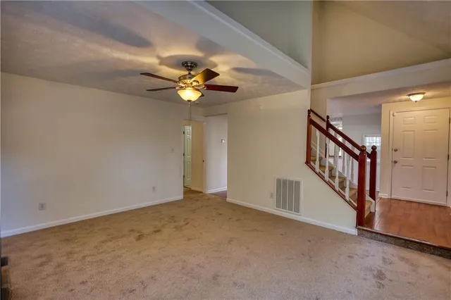 a kitchen with a sink cabinets and a window