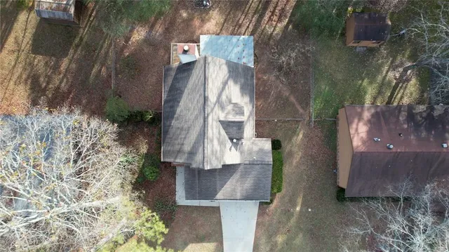 an aerial view of residential houses with outdoor space