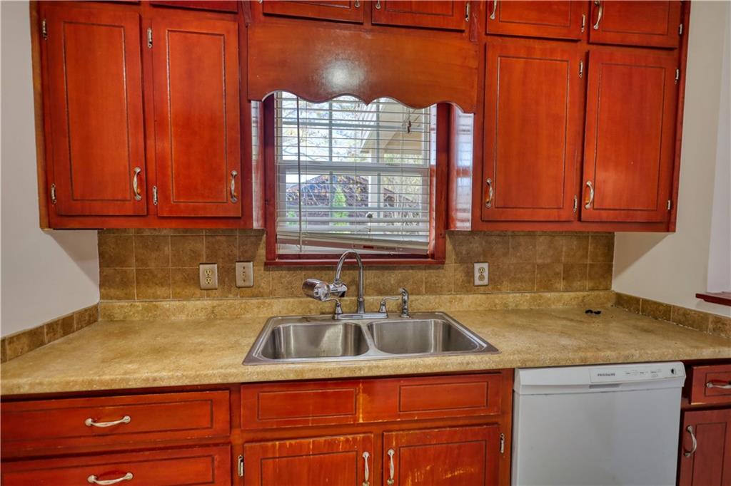 2475 Nugget Drive Southwest Conyers, GA 30094 - Photo 21 of 47 a kitchen with a sink cabinets and a window