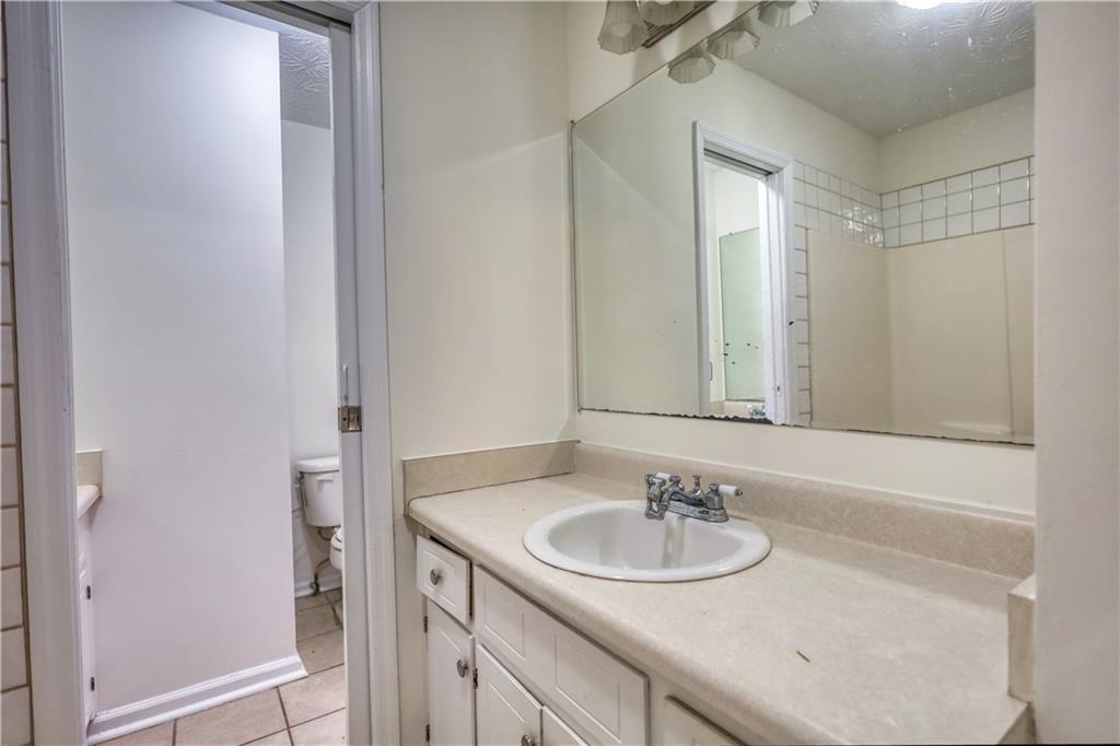 2475 Nugget Drive Southwest Conyers, GA 30094 - Photo 29 of 47 a bathroom with a sink and a mirror