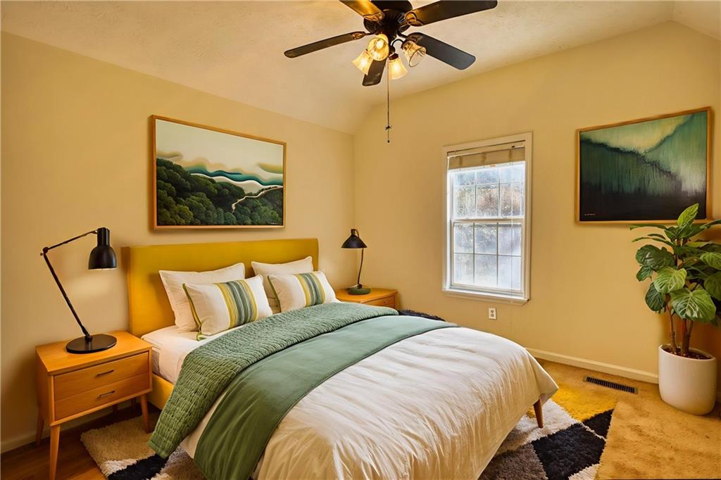 2475 Nugget Drive Southwest Conyers, GA 30094 - Photo 35 of 47 a bedroom with a bed and a flat screen tv