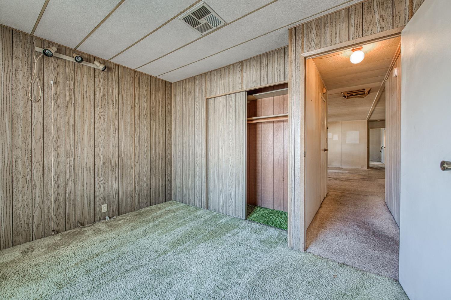 1300 West Olson Avenue, Unit 75 Reedley, CA 93654 - Photo 22 of 40 en empty room with wooden floor