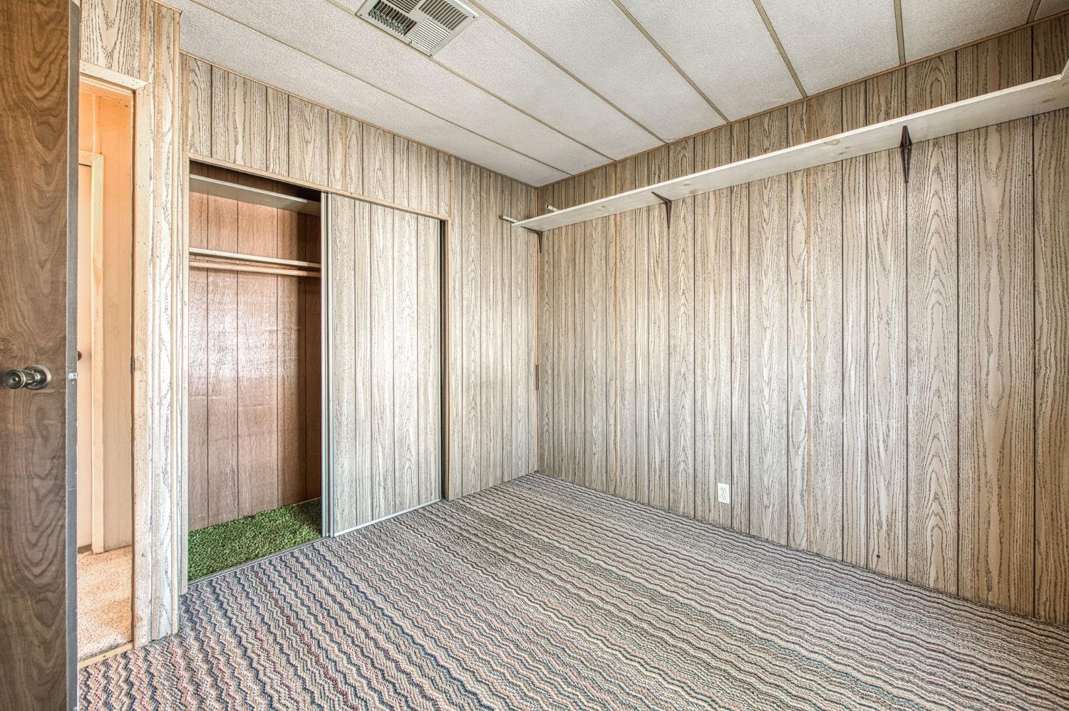 1300 West Olson Avenue, Unit 75 Reedley, CA 93654 - Photo 25 of 40 a view of a room with a wooden door